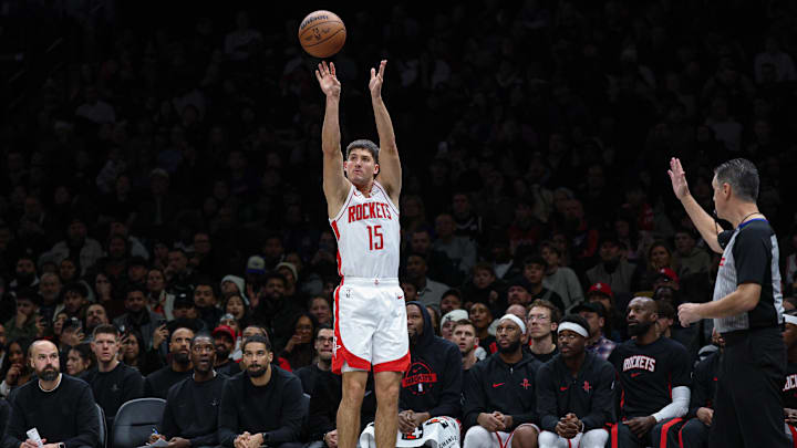 Jan 1, 2026; Brooklyn, New York, USA; Houston Rockets guard Reed Sheppard (15) shoots the ball against the Brooklyn Nets during the second half at Barclays Center. Mandatory Credit: Vincent Carchietta-Imagn Images