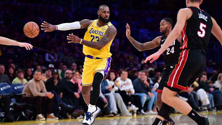 January 15, 2025; Los Angeles, California, USA; Los Angeles Lakers forward LeBron James (23) passes the ball against Miami Heat forward Haywood Highsmith (24) during the second half at Crypto.com Arena. Mandatory Credit: Gary A. Vasquez-Imagn Images