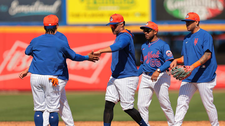 Feb 17, 2025; Port St. Lucie, FL, USA; New York Mets right fielder Juan Soto (22) celebrates with shortstop Francisco Lindor (12) during a spring training workout at Clover Park. Mandatory Credit: Sam Navarro-Imagn Images