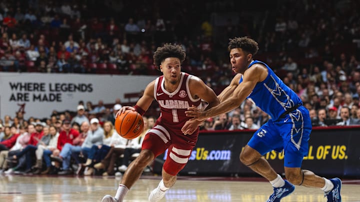 Dec 14, 2024; Tuscaloosa, Alabama, USA; Alabama Crimson Tide guard Mark Sears (1) drives the ball against Creighton Bluejays guard Shane Thomas (12) during the first half at Coleman Coliseum. Mandatory Credit: Will McLelland-Imagn Images Dec 14, 2024; Tuscaloosa, Alabama, USA; Alabama Crimson Tide guard Mark Sears (1) drives the ball against Creighton Bluejays guard Shane Thomas (12) during the first half at Coleman Coliseum. Mandatory Credit: Will McLelland-Imagn Images