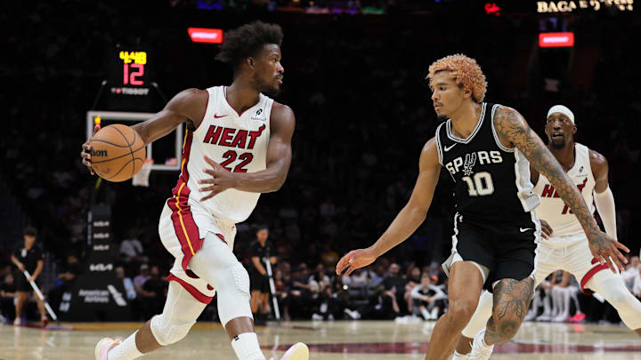 Oct 15, 2024; Miami, Florida, USA; Miami Heat forward Jimmy Butler (22) drives to the basket against San Antonio Spurs forward Jeremy Sochan (10) during the third quarter at Kaseya Center.