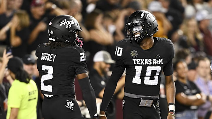 Oct 26, 2024; College Station, Texas, USA; Texas A&M Aggies quarterback Marcel Reed (10) and running back Rueben Owens (2) react during the fourth quarter against the LSU Tigers. The Aggies defeated the Tigers 38-23; at Kyle Field. Mandatory Credit: Maria Lysaker-Imagn Images.  