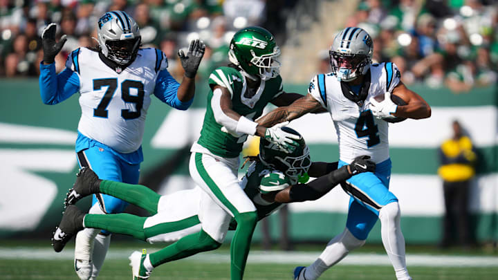 New York Jets linebacker Jamien Sherwood (44) attempts to tackle Carolina Panthers wide receiver Tetairoa McMillan (4) during a game at MetLife Stadium, Oct 19, 2025, East Rutherford, NJ, USA. New York Jets linebacker Jamien Sherwood (44) attempts to tackle Carolina Panthers wide receiver Tetairoa McMillan (4) during a game at MetLife Stadium, Oct 19, 2025, East Rutherford, NJ, USA.