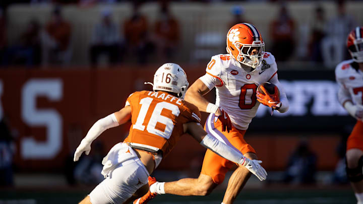 Dec 21, 2024; Austin, Texas, USA; Clemson Tigers wide receiver Antonio Williams (0) against Texas Longhorns defensive back Michael Taaffe (16) during the first half of the CFP National playoff first round at Darrell K Royal-Texas Memorial Stadium. Mandatory Credit: Mark J. Rebilas-Imagn Images Dec 21, 2024; Austin, Texas, USA; Clemson Tigers wide receiver Antonio Williams (0) against Texas Longhorns defensive back Michael Taaffe (16) during the first half of the CFP National playoff first round at Darrell K Royal-Texas Memorial Stadium. Mandatory Credit: Mark J. Rebilas-Imagn Images