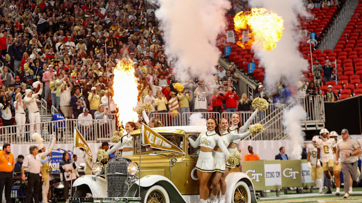 Nov 28, 2025; Atlanta, Georgia, USA; Georgia Tech Yellow Jackets cheerleaders ride the Ramblin' Wreck car before a game against the Georgia Bulldogs at Mercedes-Benz Stadium. Mandatory Credit: Brett Davis-Imagn Images Nov 28, 2025; Atlanta, Georgia, USA; Georgia Tech Yellow Jackets cheerleaders ride the Ramblin' Wreck car before a game against the Georgia Bulldogs at Mercedes-Benz Stadium. Mandatory Credit: Brett Davis-Imagn Images