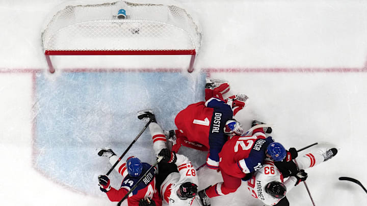 [US, Mexico & Canada customers only] Feb 12, 2026; Milan, Italy; Mitch Marner and Sidney Crosby of Canada in action with Radek Faksa, Lukas Dostal and Jan Rutta of Czechia in a men's ice hockey Group A match during the Milano Cortina 2026 Olympic Winter Games at Milano Santagiulia Ice Hockey Arena. Mandatory Credit: Mike Segar/Reuters via Imagn Images