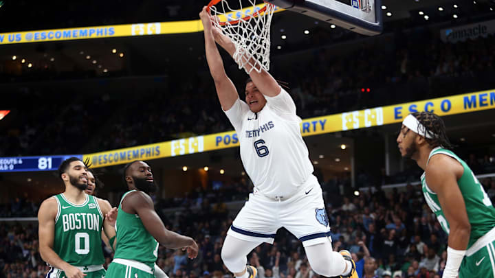 Memphis Grizzlies forward Kenneth Lofton Jr. (6) dunks during the second half against the Boston Celtics at FedExForum. Mandatory Credit: Petre Thomas-Imagn Images