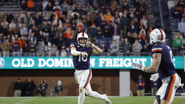 Nov 8, 2025; Charlottesville, Virginia, USA; Virginia Cavaliers quarterback Daniel Kaelin (10) passes the ball to Virginia Cavaliers tight end Sage Ennis (0) against the Wake Forest Demon Deacons during the second half at Scott Stadium. Mandatory Credit: Amber Searls-Imagn Images