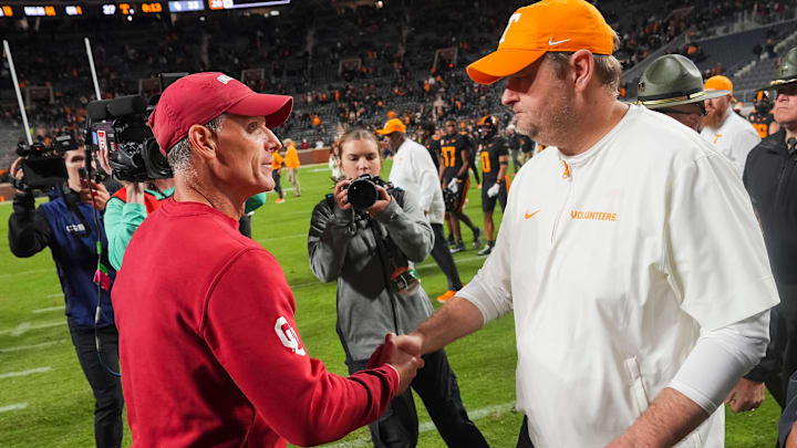 Oklahoma coach Brent Venables and Tennessee coach Josh Heupel shake hands after Oklahoma defeated Tennessee 33-27 in Neyland Stadium in Knoxville on Nov. 1, 2025. Oklahoma coach Brent Venables and Tennessee coach Josh Heupel shake hands after Oklahoma defeated Tennessee 33-27 in Neyland Stadium in Knoxville on Nov. 1, 2025.