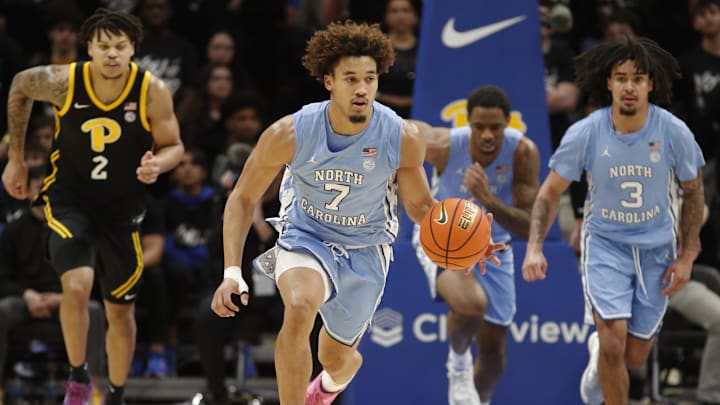Jan 28, 2025; Pittsburgh, Pennsylvania, USA;  North Carolina Tar Heels guard Seth Trimble (7) brings the ball up court on a fast break against the Pittsburgh Panthers during the second half at the Petersen Events Center. Mandatory Credit: Charles LeClaire-Imagn Images