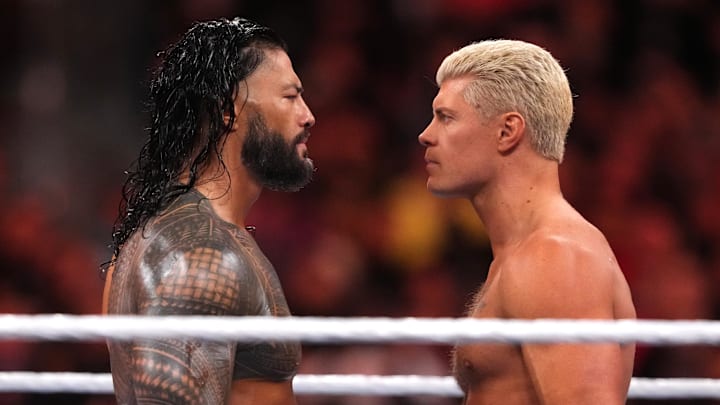 Apr 2, 2023; Inglewood, CA, USA; Cody Rhodes (navy blue pants) and Roman Reigns (black pants) during