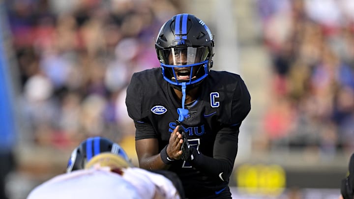 Nov 16, 2024; Dallas, Texas, USA; SMU Mustangs quarterback Kevin Jennings (7) sets the play against the Boston College Eagles during the first half at the Gerald J. Ford Stadium. Mandatory Credit: Jerome Miron-Imagn Images