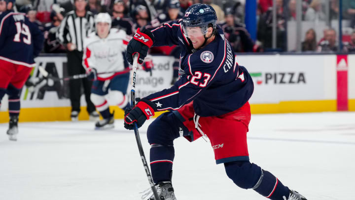 Oct 5, 2023; Columbus, Ohio, USA; Columbus Blue Jackets defenseman Jake Christiansen (23) shoots the puck against the Washington Capitals in the second period at Nationwide Arena. Mandatory Credit: Aaron Doster-USA TODAY Sports Oct 5, 2023; Columbus, Ohio, USA; Columbus Blue Jackets defenseman Jake Christiansen (23) shoots the puck against the Washington Capitals in the second period at Nationwide Arena. Mandatory Credit: Aaron Doster-USA TODAY Sports