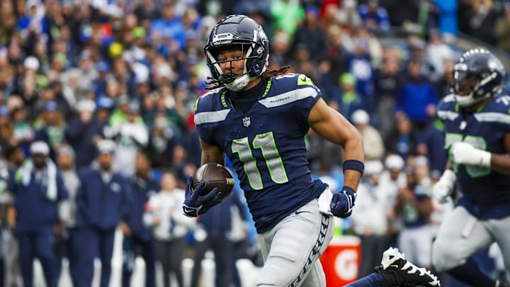 Nov 24, 2024; Seattle, Washington, USA; Seattle Seahawks wide receiver Jaxon Smith-Njigba (11) runs for yards after the catch against the Arizona Cardinals during the second quarter at Lumen Field. Mandatory Credit: Joe Nicholson-Imagn Images