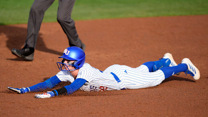 Kansas Jayhawks outfielder Aynslee Linduff (39) slides to second base in the second inning of a college softball game between the Oklahoma State Cowgirls and the Kansas Jayhawks in Stillwater, Friday, May 1, 2026. Kansas Jayhawks outfielder Aynslee Linduff (39) slides to second base in the second inning of a college softball game between the Oklahoma State Cowgirls and the Kansas Jayhawks in Stillwater, Friday, May 1, 2026.
