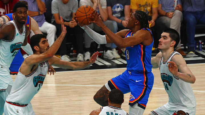 Apr 24, 2025; Memphis, Tennessee, USA; Oklahoma City Thunder forward Jalen Williams (8) shoots between Memphis Grizzlies forward Santi Aldama (7) and center Zach Edey (14) during the third quarter during game three for the first round of the 2025 NBA Playoffs at FedExForum. Mandatory Credit: Petre Thomas-Imagn Images Apr 24, 2025; Memphis, Tennessee, USA; Oklahoma City Thunder forward Jalen Williams (8) shoots between Memphis Grizzlies forward Santi Aldama (7) and center Zach Edey (14) during the third quarter during game three for the first round of the 2025 NBA Playoffs at FedExForum. Mandatory Credit: Petre Thomas-Imagn Images