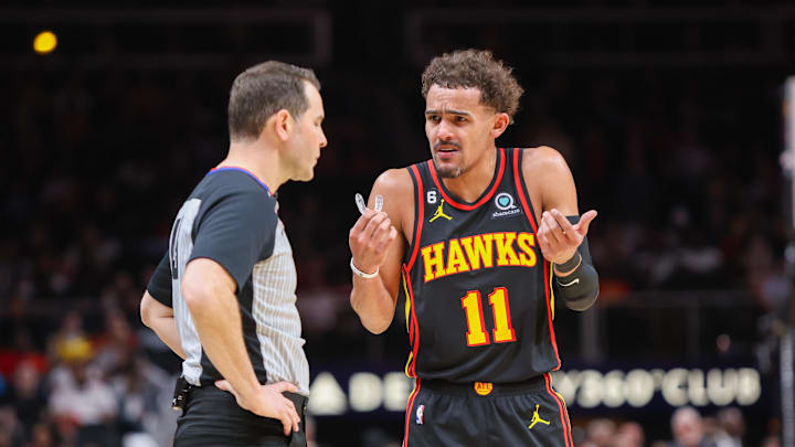 Feb 28, 2023; Atlanta, Georgia, USA; Atlanta Hawks guard Trae Young (11) talks to referee Brian Forte (45) against the Washington Wizards in the second half at State Farm Arena. Mandatory Credit: Brett Davis-Imagn Images