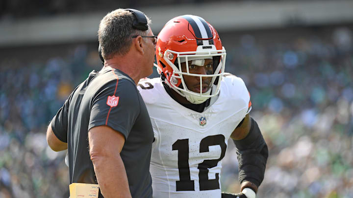 Oct 13, 2024; Philadelphia, Pennsylvania, USA; Cleveland Browns defensive coordinator Jim Schwartz talks with Cleveland Browns safety Rodney McLeod Jr. (12) against the Philadelphia Eagles during the first quarter at Lincoln Financial Field.