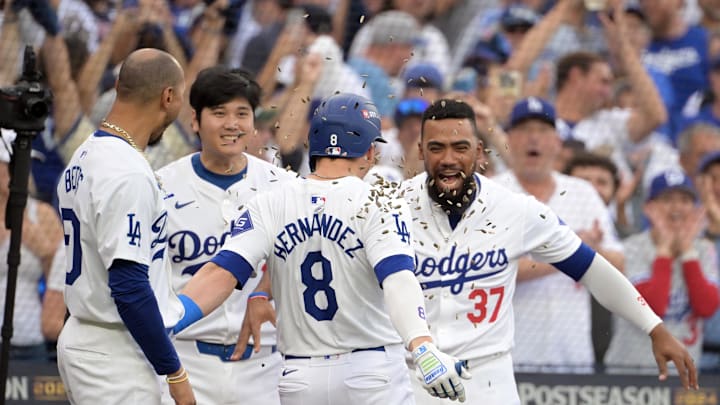 Oct 11, 2024; Los Angeles, California, USA; Los Angeles Dodgers third baseman Enrique Hernandez (8) celebrates with shortstop Mookie Betts (50) and designated hitter Shohei Ohtani (17) and outfielder Teoscar Hernandez (37) after hitting a solo home run in the second inning against the San Diego Padres during game five of the NLDS for the 2024 MLB Playoffs at Dodger Stadium. Mandatory Credit: Jayne Kamin-Oncea-Imagn Images