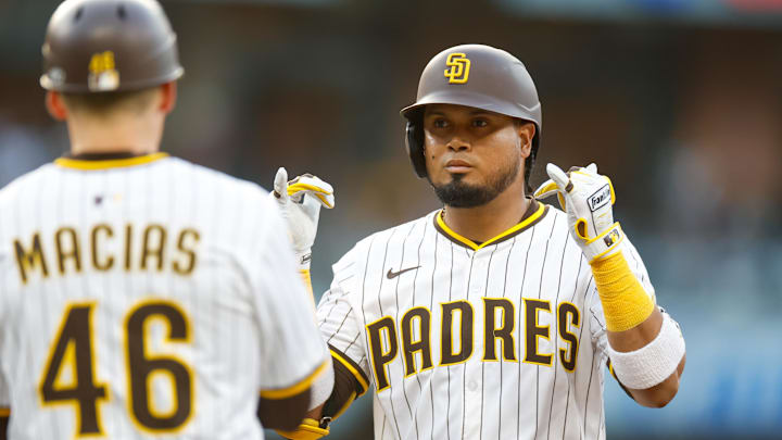 Jun 9, 2025; San Diego, California, USA; San Diego Padres first baseman Luis Arraez (4) celebrates with the dugout after hitting a single during the first inning against the Los Angeles Dodgers at Petco Park. Mandatory Credit: David Frerker-Imagn Images