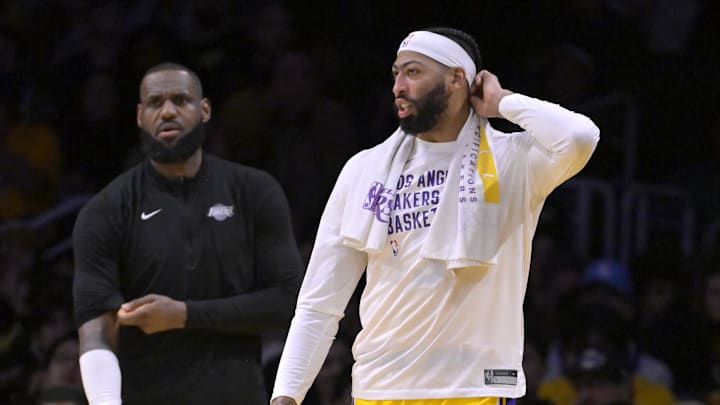 Dec 28, 2023; Los Angeles, California, USA; Los Angeles Lakers forward LeBron James (23) and forward Anthony Davis (3) look on from the bench in the fourth quarter against the Charlotte Hornets at Crypto.com Arena. Mandatory Credit: Jayne Kamin-Oncea-USA TODAY Sports