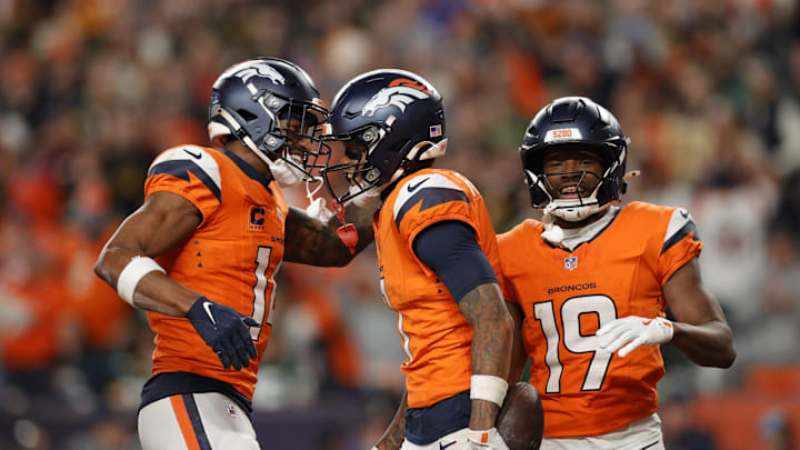 Dec 14, 2025; Denver, Colorado, USA; Denver Broncos wide receiver Troy Franklin (11), wide receiver Courtland Sutton (14) and wide receiver Marvin Mims Jr. (19) celebrate a touchdown during the third quarter against the Green Bay Packers at Empower Field at Mile High. Mandatory Credit: Isaiah J. Downing-Imagn Images
