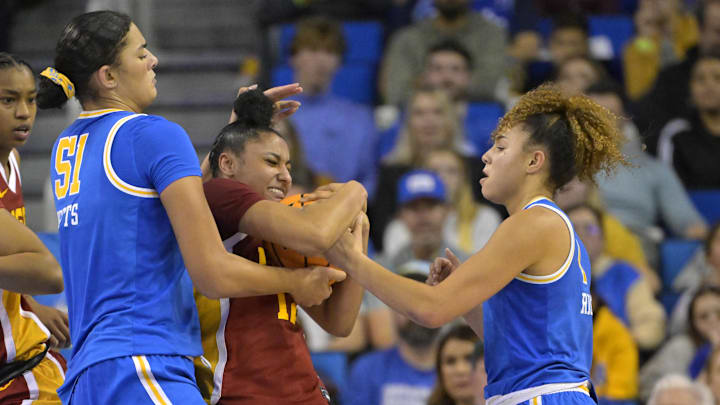 Dec 30, 2023; Los Angeles, California, USA; USC Trojans guard JuJu Watkins (12), UCLA Bruins center Lauren Betts (51) and guard Kiki Rice (1) battle for the ball in the second half at Pauley Pavilion presented by Wescom. Mandatory Credit: Jayne Kamin-Oncea-Imagn Images