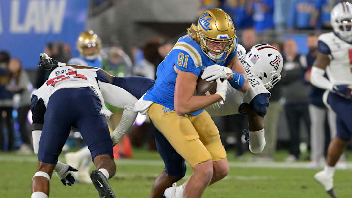 Nov 12, 2022; Pasadena, California, USA;   UCLA Bruins tight end Hudson Habermehl (81) completes a 51 yard pass play and runs into the end zone for a touchdown in the first half against the Arizona Wildcats at the Rose Bowl. Mandatory Credit: Jayne Kamin-Oncea-Imagn Images