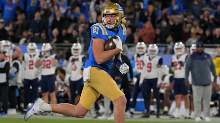 Nov 12, 2022; Pasadena, California, USA;   UCLA Bruins tight end Hudson Habermehl (81) completes a 51 yard pass play and runs into the end zone for a touchdown in the first half against the Arizona Wildcats at the Rose Bowl. Mandatory Credit: Jayne Kamin-Oncea-Imagn Images