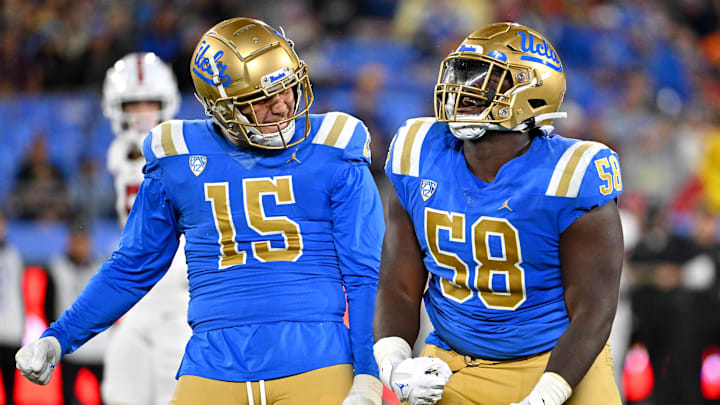 Oct 29, 2022; Pasadena, California, USA;  UCLA Bruins linebacker Laiatu Latu (15) and defensive lineman Gary Smith III (58) celebrate after a sack of Stanford Cardinal quarterback Tanner McKee (18)  in the first half at the Rose Bowl. Mandatory Credit: Jayne Kamin-Oncea-Imagn Images