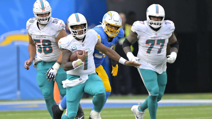 Miami Dolphins quarterback Tua Tagovailoa (1) runs to the 35-yard line for a first down in the third quarter of the game against the Los Angeles Chargers at SoFi Stadium in 2023.