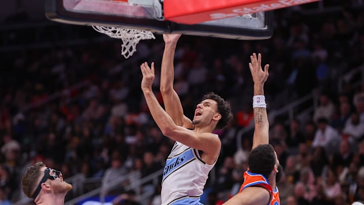 Feb 28, 2025; Atlanta, Georgia, USA; Atlanta Hawks forward Zaccharie Risacher (10) shoots against the Oklahoma City Thunder in the third quarter at State Farm Arena. Mandatory Credit: Brett Davis-Imagn Images