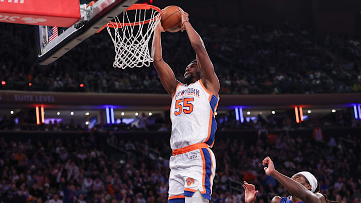 Dec 7, 2024; New York, New York, USA; New York Knicks center Ariel Hukporti (55) dunks during the second half against the Detroit Pistons at Madison Square Garden. Mandatory Credit: Vincent Carchietta-Imagn Images