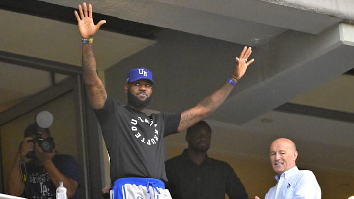 Aug 19, 2023; Los Angeles, California, USA;  The Los Angeles Lakers LeBron James (23) acknowledges the crowd as he attends the game between the Los Angeles Dodgers and the Miami Marlins on his bobblehead night at Dodger Stadium. Mandatory Credit: Jayne Kamin-Oncea-Imagn Images