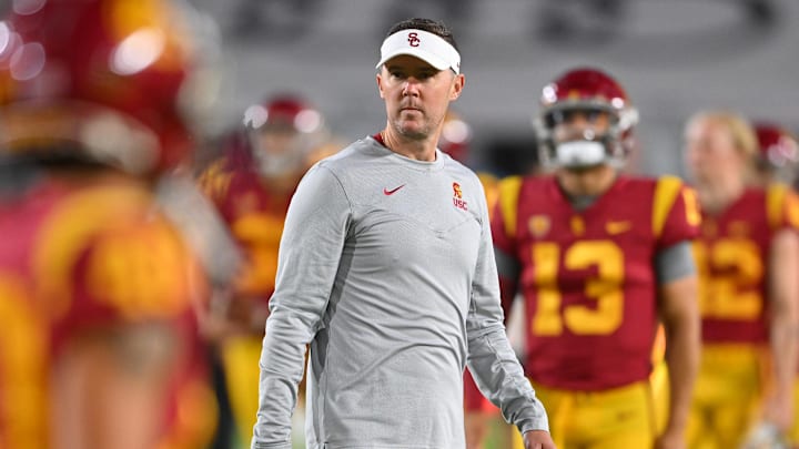Oct 1, 2022; Los Angeles, California, USA;  USC Trojans head coach Lincoln Riley walks on the field before a game against the Arizona State Sun Devils at United Airlines Field at the Los Angeles Memorial Coliseum. Mandatory Credit: Jayne Kamin-Oncea-Imagn Images