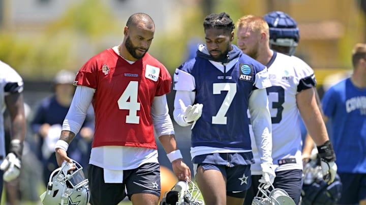 Dallas Cowboys quarterback Dak Prescott talks with cornerback Trevon Diggs during training camp at River Ridge Playing Fields 