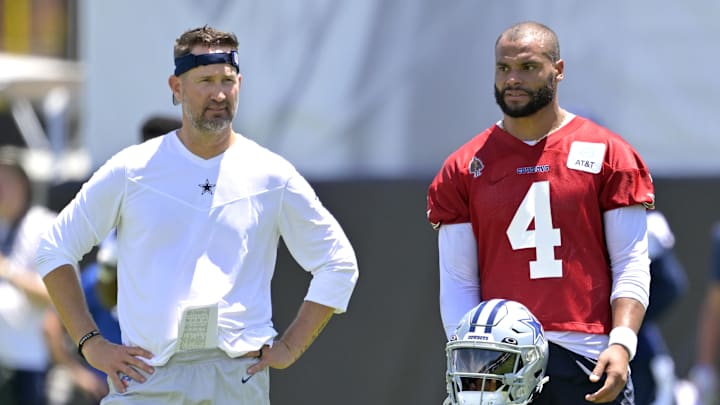 Dallas Cowboys quarterback Dak Prescott talks with Brian Schottenheimer during training camp in Oxnard, California 