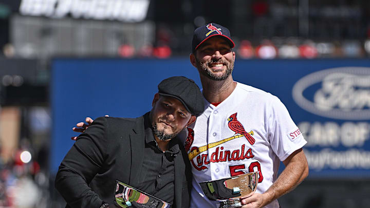 Oct 1, 2023; St. Louis, Missouri, USA;  St. Louis Cardinals starting pitcher Adam Wainwright (50) hugs former teammate Yadier Molina during his retirement ceremony before a game against the Cincinnati Reds at Busch Stadium. Mandatory Credit: Jeff Curry-Imagn Images
