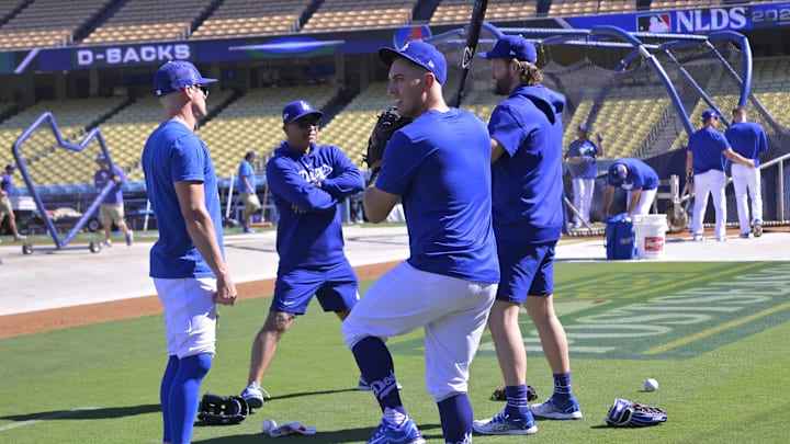 Oct 6, 2023; Los Angeles, CA, USA;  Los Angeles Dodgers shortstop Enrique Hernandez (8), manager Dave Roberts (30), starting pitcher Clayton Kershaw (22) and catcher Austin Barnes (15) on the field during NLDS workouts at Dodgers Stadium. Mandatory Credit: Jayne Kamin-Oncea-Imagn Images