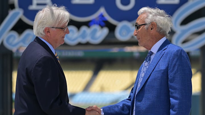 Mark Walter, Owner and Chairman of the Los Angeles Dodgers shakes hands with Sandy Koufax during an unveiling for his commemorative statue at the Centerfield Plaza at Dodger Stadium on June 18, 2022.