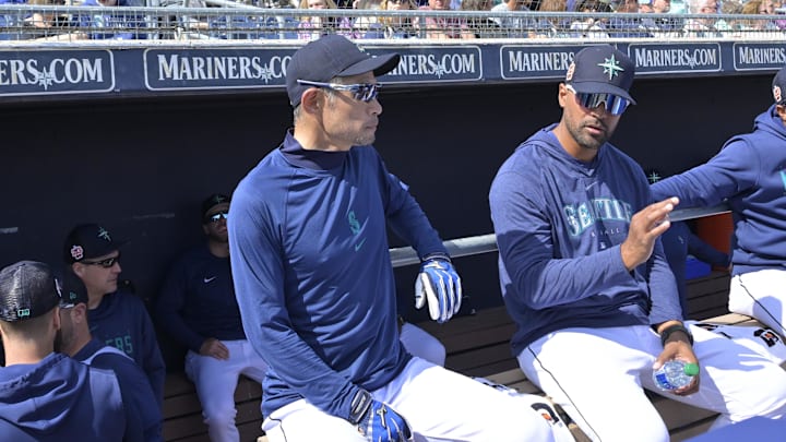Seattle Mariners coach Ichiro Suzuki (51) looks on from the dugout during the spring training game against the Cleveland Guardians at the Peoria Sports Complex in 2023.