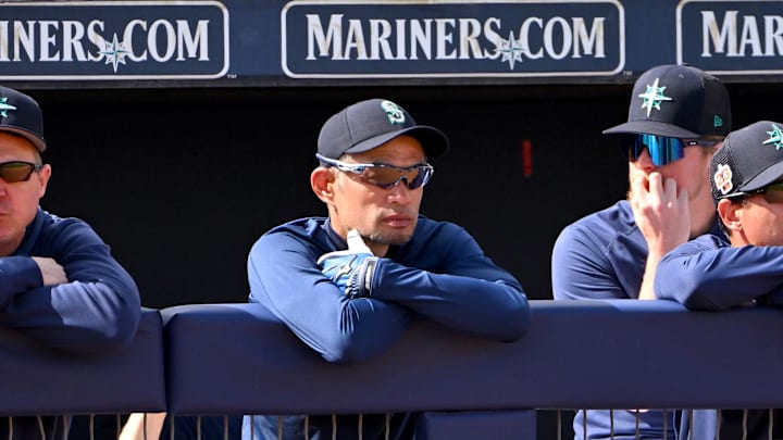 Seattle Mariners coach Ichiro Suzuki (51) looks on from the dugout during the spring training game against the Cleveland Guardians at the Peoria Sports Complex in 2023.