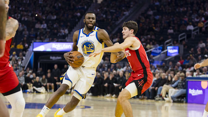 Dec 5, 2024; San Francisco, California, USA;  Houston Rockets guard Reed Sheppard (15) defends against Golden State Warriors forward Andrew Wiggins (22) during the first quarter at Chase Center. Mandatory Credit: John Hefti-Imagn Images