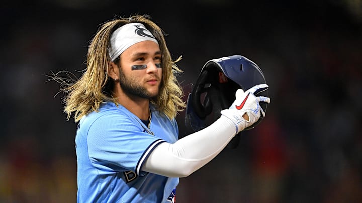 May 28, 2022; Anaheim, California, USA;  Toronto Blue Jays shortstop Bo Bichette (11) throws his helmet after a ground out in the seventh inning against the Los Angeles Angels at Angel Stadium. Mandatory Credit: Jayne Kamin-Oncea-Imagn Images