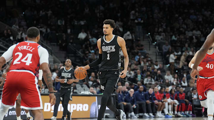 Dec 31, 2024; San Antonio, Texas, USA; San Antonio Spurs center Victor Wembanyama (1) dribbles in front of LA Clippers guard Norman Powell (24) in the second half at Frost Bank Center. Mandatory Credit: Daniel Dunn-Imagn Images Dec 31, 2024; San Antonio, Texas, USA; San Antonio Spurs center Victor Wembanyama (1) dribbles in front of LA Clippers guard Norman Powell (24) in the second half at Frost Bank Center. Mandatory Credit: Daniel Dunn-Imagn Images