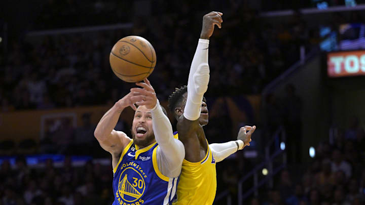 May 12, 2023; Los Angeles, California, USA; Golden State Warriors guard Stephen Curry (30) is fouled by Los Angeles Lakers guard Dennis Schroder (17) as they go up for a rebound in the first half of game six of the 2023 NBA playoffs at Crypto.com Arena. Mandatory Credit: Jayne Kamin-Oncea-Imagn Images