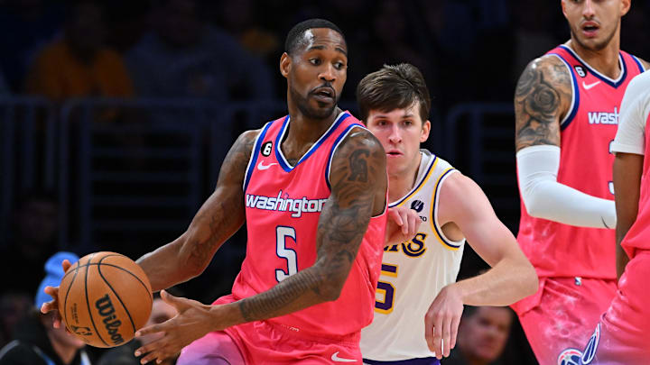 Dec 18, 2022; Los Angeles, California, USA; Los Angeles Lakers guard Austin Reaves (15) chases down Washington Wizards forward Will Barton (5) in the first half at Crypto.com Arena. Mandatory Credit: Jayne Kamin-Oncea-Imagn Images