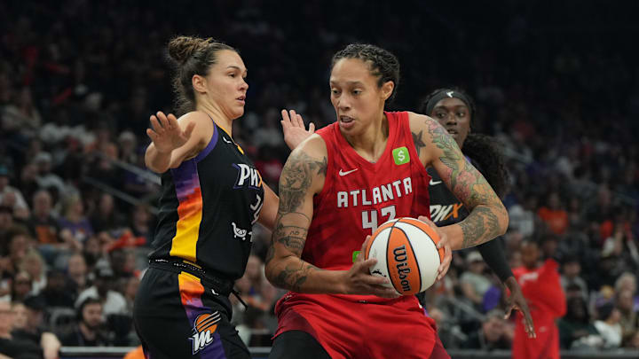 Jul 23, 2025; Phoenix, Arizona, USA; Atlanta Dream center Brittney Griner (42) drives on Phoenix Mercury forward Kathryn Westbeld (24) in the first half at Footprint Center. Mandatory Credit: Rick Scuteri-Imagn Images