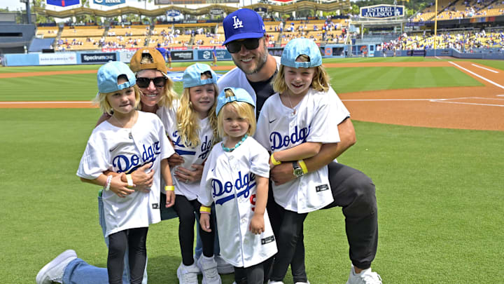 Los Angeles Rams quarterback Matthew Stafford with his wife Kelly with their 4 daughters on the field prior to the game between the Los Angeles Dodgers and the Atlanta Braves at Dodger Stadium.