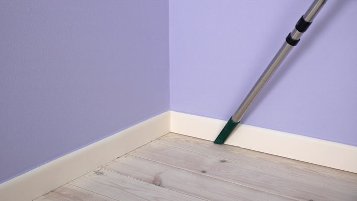 Using a vacuum is one of the easiest ways to clean baseboards.